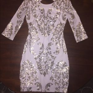 Knee length white and gold homecoming dress.